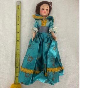 Old doll‎ with sleepy eyes, blue & gold dress vintage
